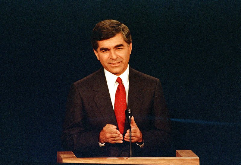 In this Sept. 25, 1988 file photo, Massachusetts Democratic Governor Michael Dukakis makes a point during the first presidential debate with his opponent U.S. Vice President George Bush in Winston-Salem, N.C. Dukakis, who lost to George H.R. Bush in the 1988 presidential election, said Saturday, Dec. 1, 2018 that his former political foe's legacy was his effort to help end the Cold War. "Obviously we disagreed pretty strongly on domestic policy and I wasn't thrilled with the kind of campaign he ran, but I think his greatest contribution was in negotiating the end of the Cold War with (Soviet leader) Mikhail Gorbachev," Dukakis told The Associated Press in a telephone interview. (AP Photo/Bob Jordan, File)