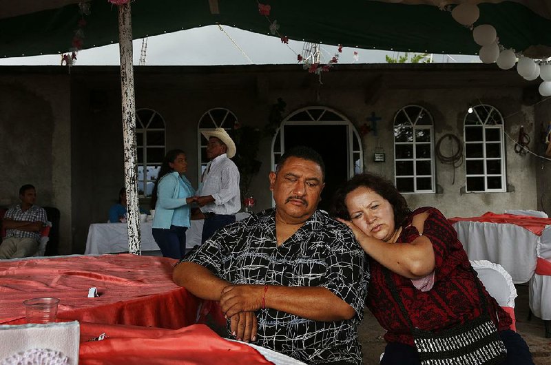 Maria Mendoza-Sanchez  leans on husband Eusebio Sanchez  after they were deported to Mexico last year. 