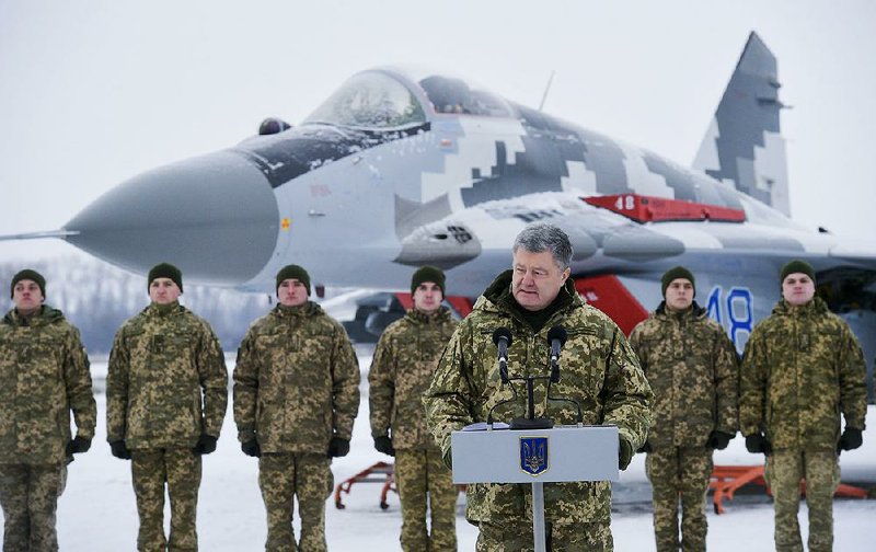 Ukrainian President Petro Poroshenko addresses the troops Saturday at a military airfield in the country’s Vasylkiv region. 