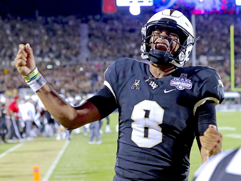 The Associated Press MACK UP: Central Florida quarterback Darriel Mack Jr. celebrates Saturday after scoring the go-ahead touchdown against Memphis in the second half of the American Athletic Conference championship game in Orlando, Fla.