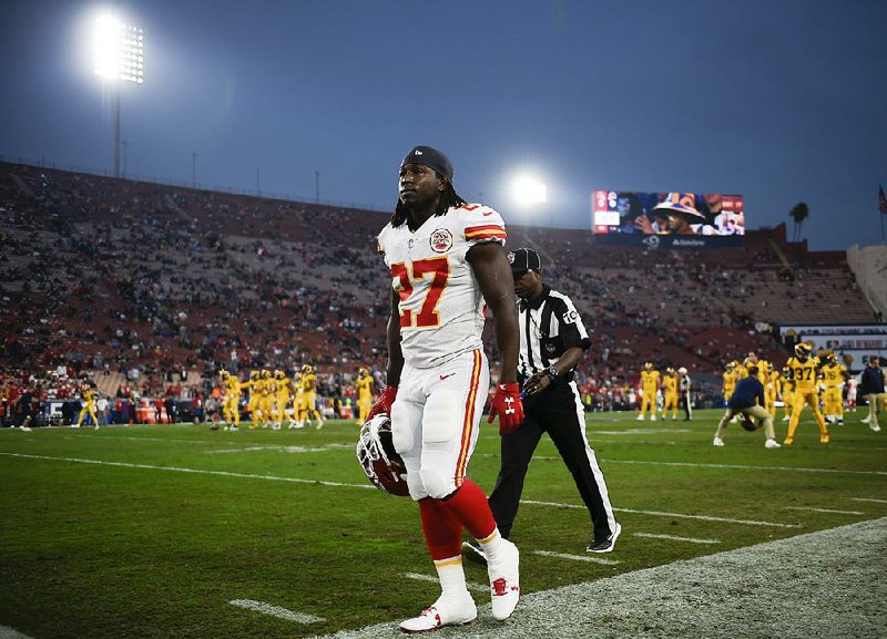Kansas City Chiefs running back Kareem Hunt walks off the field prior to an NFL football game against the Los Angeles Rams Monday, Nov. 19, 2018, in Los Angeles.