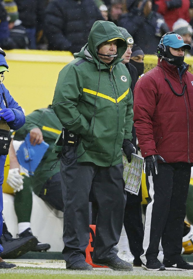 Green Bay Coach Mike McCarthy (center) was fired after the Packers’ 20-17 loss to the Arizona Cardinals on Sunday. The loss dropped the Packers’ record to 4-7-1.