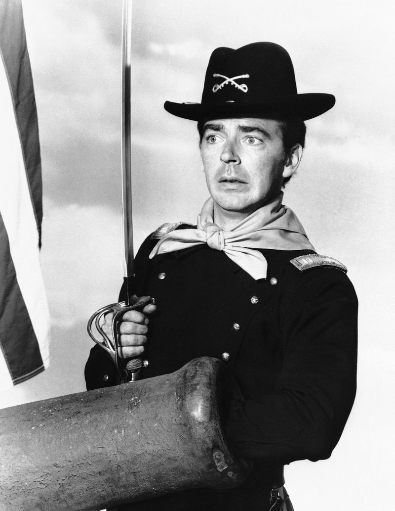 FILE - In a July 1, 1965 file photo, Ken Berry, who plays Captain Wilton Parmenter in a TV series called &quot;F Troop,&quot; reaches down the wrong end of cannon in one of the show's episodes. A spokeswoman at Providence St. Joseph in Burbank, Calif., confirmed Berry died Saturday, Dec. 1, 2018. He was 85. (AP Photo, File)