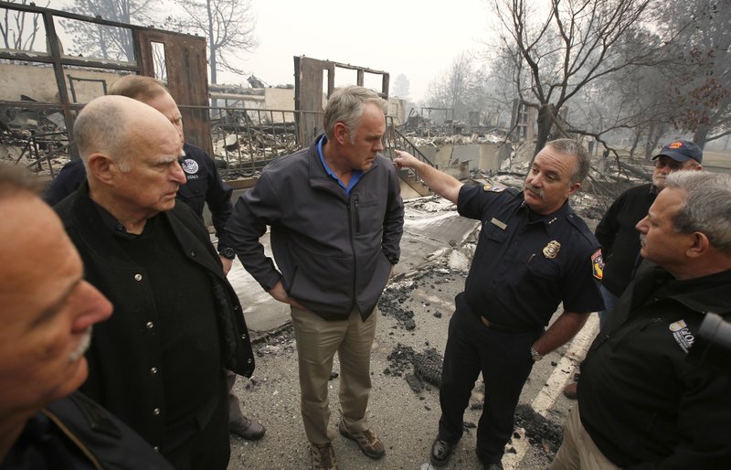 The Associated Press RETURN TO SCHOOL: In a Nov. 14 photo, Scott Upton, right, the chief of the Northern Region for the California Department of Forestry and Fire Protection briefs California Gov. Jerry Brown, second from left, Federal Emergency Management Agency Director Brock Long, third from left, and U.S. Secretary of the Interior Ryan Zinke, third from left, and Mark Ghilarducci, director of the Governor's Office of Emergency Services, right, look at the remains of Paradise Elementary school in Paradise, Calif. Monday Dec. 3 marks a return to school and some semblance of routine for thousands of children who lost their homes in the wildfire.