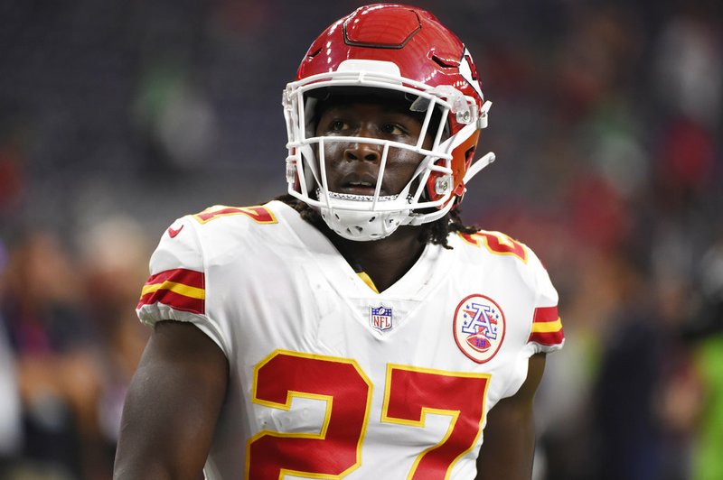 FILE - In this Oct. 8, 2017, file photo, Kansas City Chiefs running back Kareem Hunt warms up for the team's NFL football game against the Houston Texans in Houston. The Chiefs released Hunt on Friday, Nov. 30, 2018, after video surfaced that showed the NFL's reigning rushing champion knocking over and kicking a woman in a Cleveland hotel hallway in February. (AP Photo/Eric Christian Smith, File)