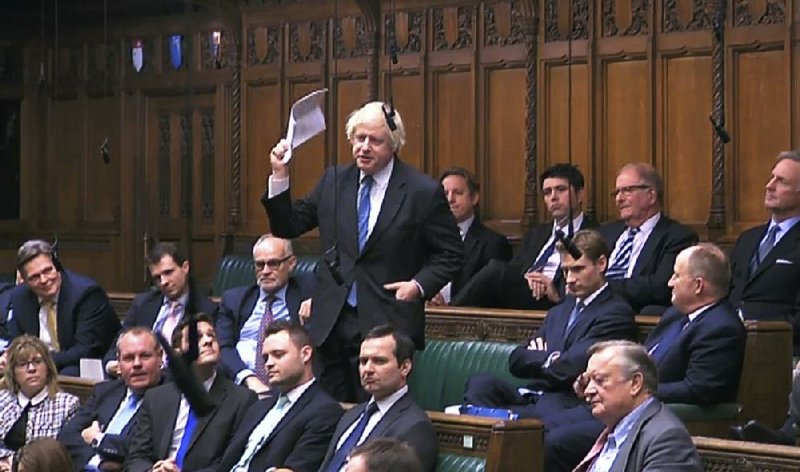 Lawmaker Boris Johnson stands to speak Tuesday in the House of Commons at the start of a five-day debate on Great Britain’s exit from the European Union. 