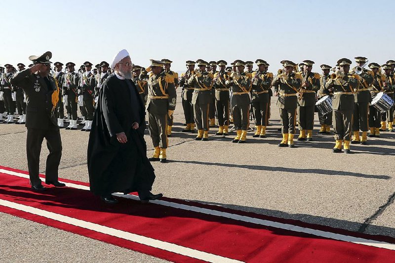 Iranian President Hassan Rouhani reviews an honor guard Tuesday after arriving in the northern Iranian city of Shahroud, where he spoke about the Strait of Hormuz. 