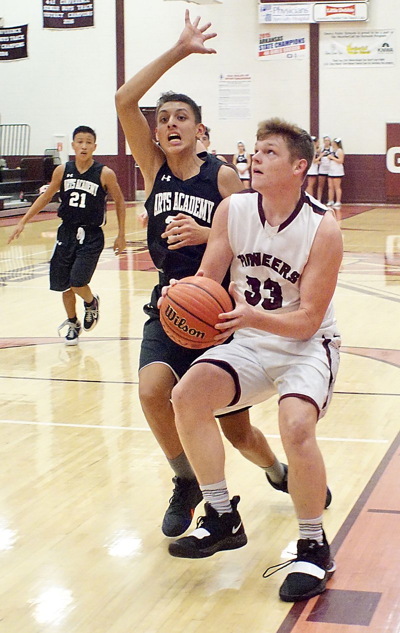 Westside Eagle Observer/RANDY MOLL Dylan Kilgore, a Gentry senior, gets ready to shoot during play against Arkansas Arts Academy at Gentry High School on Thursday, Nov. 29, 2018.