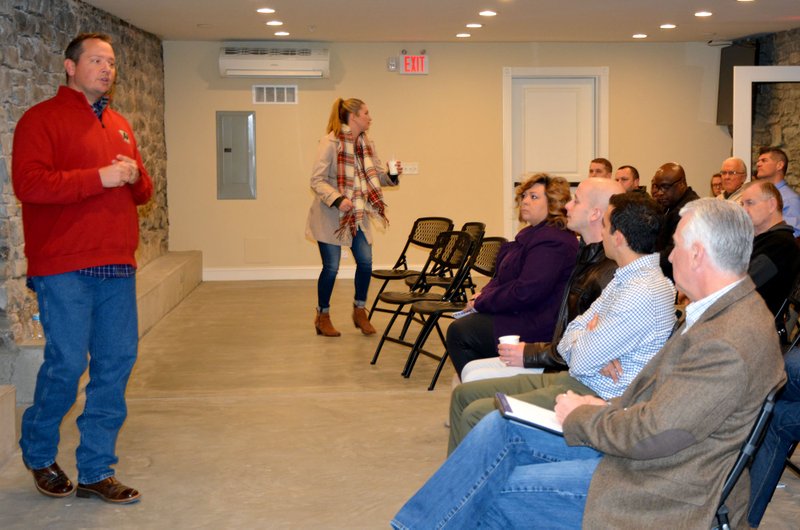 Hunter McFerrin/Herald-Leader The Chamber of Commerce held their "Coffee+E" event on Tuesday morning, where a group of community members convened for a networking session and to hear a brief speech from Grant Loyd (left) about his career. Loyd is the president of Alternative Design and Manufacturing, a Siloam Springs-based metal fabrication company. Loyd spoke about a wide range of issues pertaining to his career; from the good, the bad and everything in between.