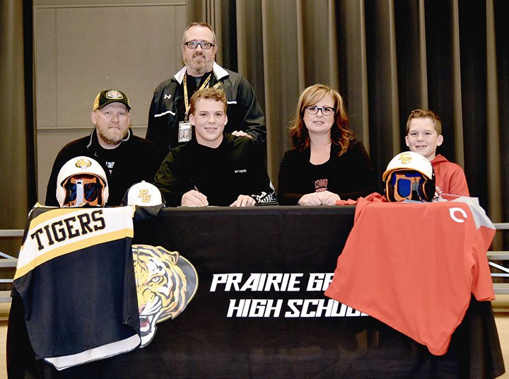 Shelley Williams special to the Enterprise-Leader/Prairie Grove senior Couper Allen signed a national letter of intent to play college baseball for Coffeyville Community College, of Coffeyville, Kan. on Friday, Nov. 30, 2018. Couper's family (from left): Rodney Allen, father; Couper; Mandy Allen, mother; and Spencer Allen, brother; joined him for the celebration. Standing behind Couper is Prairie Grove baseball coach Chris Mileham.