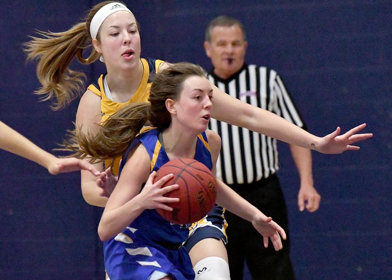 Photo courtesy of Texas Wesleyan
John Brown sophomore Taylor Fergen drives by a Texas Wesleyan defender during Saturday's game. The Rams defeated the Golden Eagles 69-61.