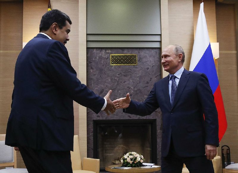 Venezuelan President Nicolas Maduro (left) arrives Wednesday for a meeting with Russian President Vladimir Putin outside Moscow. In remarks to Russian news agencies, Putin warned that Russia will follow suit if Washington exits the Intermediate-Range Nuclear Forces Treaty and starts developing missiles banned under the accord. His threat came a day after Secretary of State Mike Pompeo at a NATO gathering accused Russia of treaty “cheating” by developing a new cruise missile. 