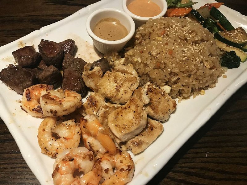 The Filet, Chicken & Shrimp hibachi dinner comes with fried rice and vegetables at Samu in Little Rock. 