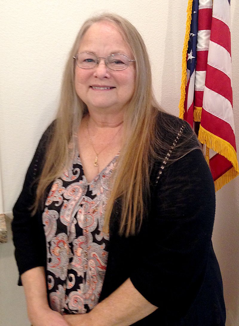 Sally Carroll/McDonald County Press Karen Dobbs served McDonald County for several years in her career as a social worker. Today, the kind-hearted grandmother of 12 makes a difference in preserving history in her role as the McDonald County Historical Society president.