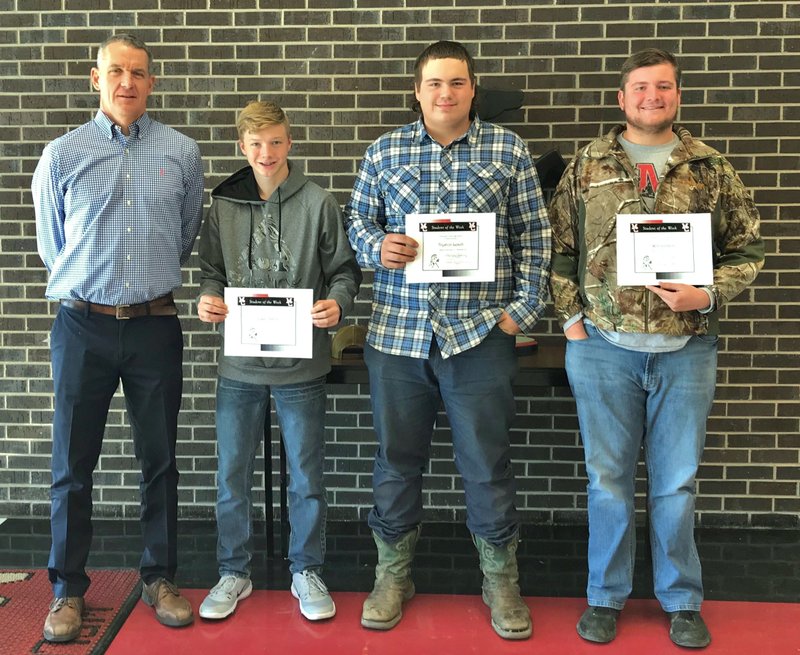 Photo Submitted MCHS Students for the week of Nov. 13 to Nov. 16 shown above with Mr. Wilkie (left) are sophomore Justin Smith, junior Tryston Leach and senior Will Gordon. Freshman Courtney Keaton is not pictured.
