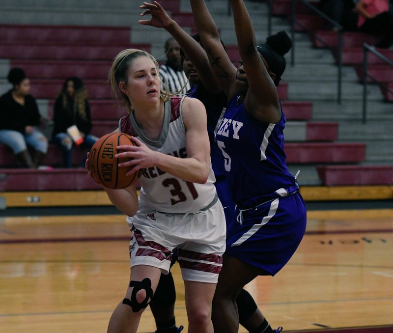 PASS THE ROCK: Henderson State senior forward Brittany Branum (31) looks for a passing option Tuesday during the Reddies' 61-45 win against Wiley College at the Duke Wells Center in Arkadelphia. Photo by Hunter Lively, courtesy of Henderson State Athletic Communications.