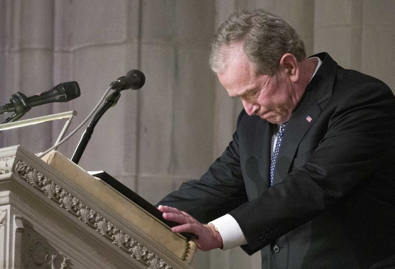 Former President George W. Bush becomes emotional as he speaks at the State Funeral for his father, former President George H.W. Bush, at the National Cathedral, Wednesday, Dec. 5, 2018, in Washington. (AP Photo/Alex Brandon, Pool)