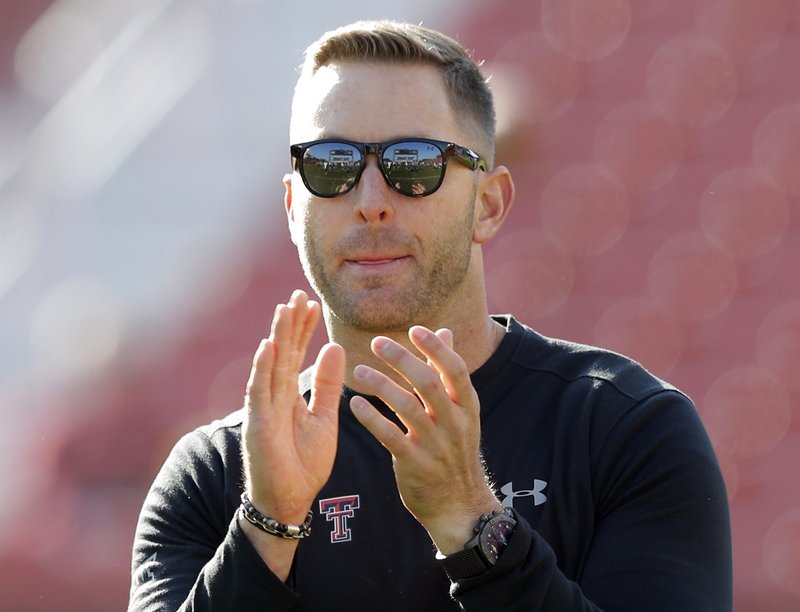 Former Texas Tech coach Kliff Kingsbury was named Clay Helton’s offensive coordinator and quarterbacks coach at Southern California.