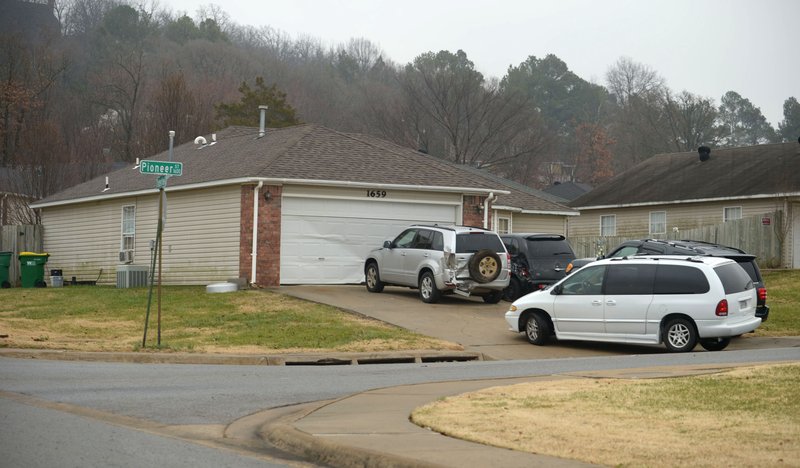 Cars sit in front of a house Thursday, Dec. 6, 2018, at 1659 Pioneer St. in Springdale. A 19-year-old man was found dead from an apparent gunshot wound Thursday, according to a news release from the Springdale Police Department.