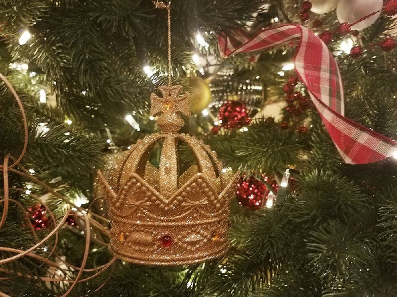 This crown ornament, which the author and her husband picked up on a trip to England’s Tower of London, forms the foundation for a tree that will evolve over years to reflect their newly blended family, travels and passions. 