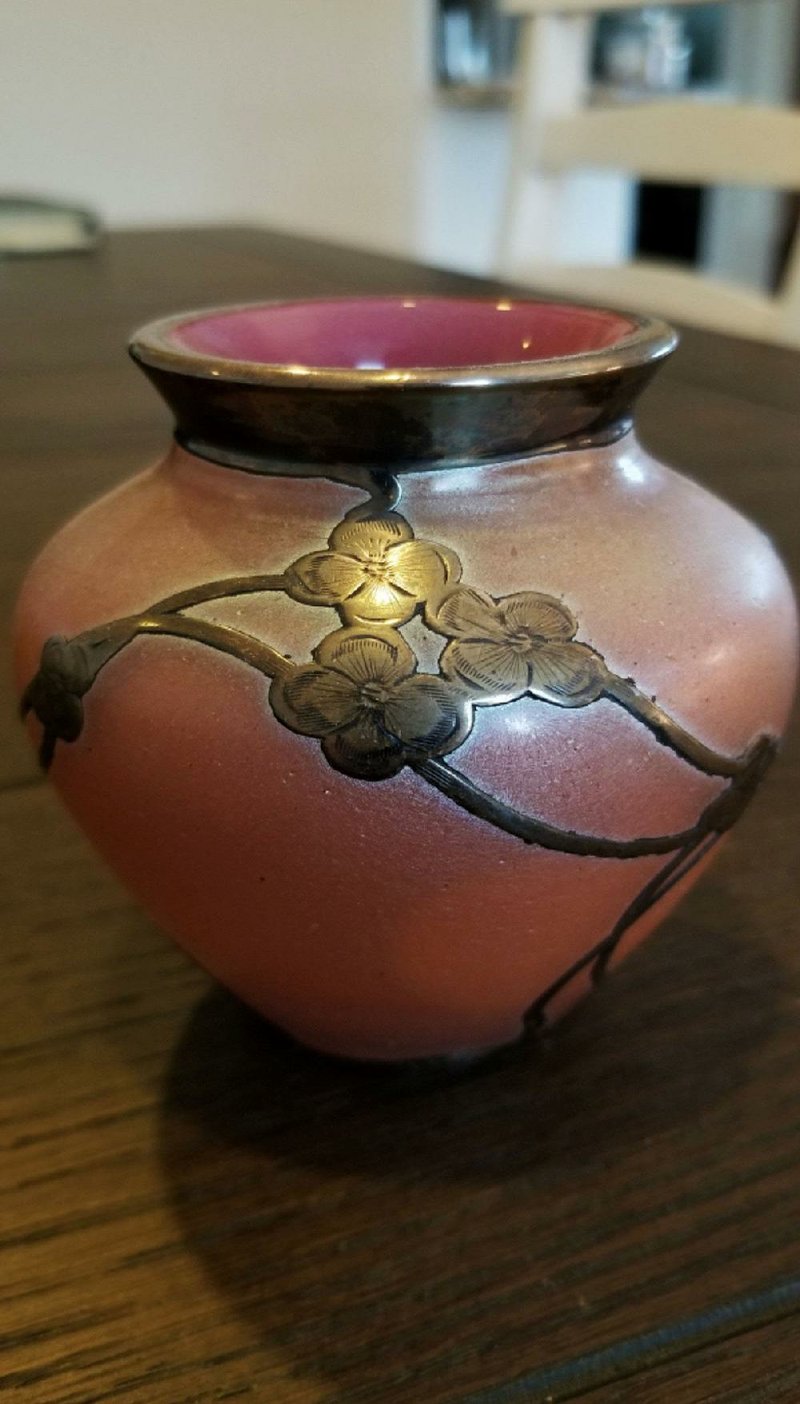 This small rose-colored vase was made by the Bohemian company of Loetz Witwe, and might sell at auction for $450 to $600. 