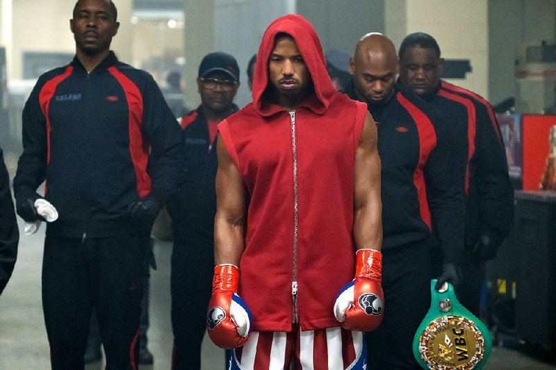 Wood Harris (left) stars as Tony “Little Duke” Burton and Michael B. Jordan (center) plays Adonis Creed in MGM’s boxing drama Creed II. It landed in third place at last weekend’s box office and made about $16.8 million.