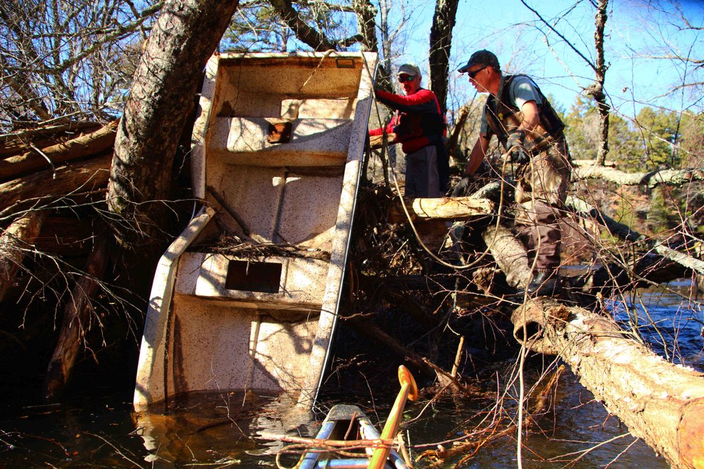Black Ops team takes down and floats out massive rubbish dumped into