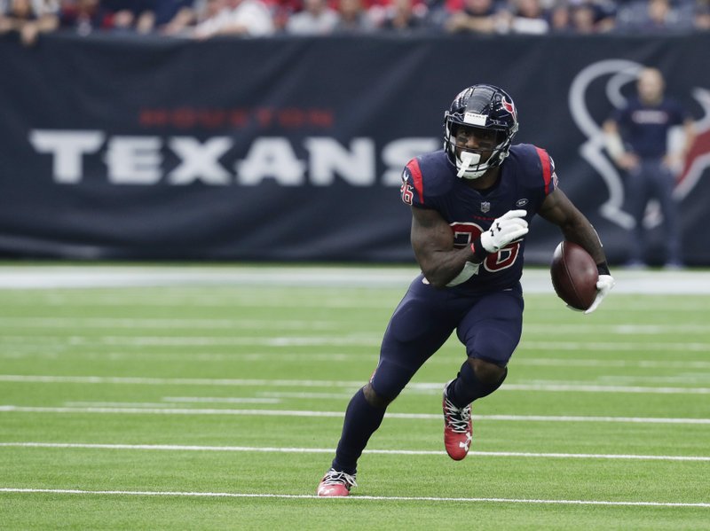 The Associated Press LEAN CUT: Texans running back Lamar Miller (26) runs the ball Sunday during the first half of a 29-13 win against the Cleveland Browns in Houston.