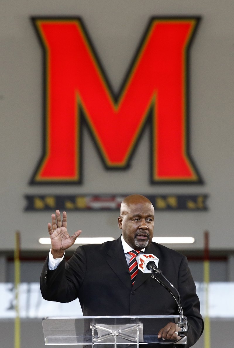 The Associated Press BACK HOME: Maryland's new head football coach Mike Locksley speaks Thursday at a new conference in College Park, Md.