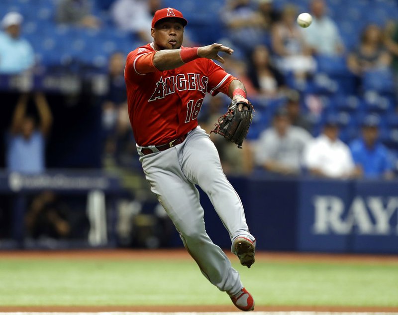 In this May 25, 2017, file photo, Los Angeles Angels third baseman Luis Valbuena throws out Tampa Bay Rays' Kevin Kiermaier on a sacrifice bunt during the fifth inning of a baseball game in St. Petersburg, Fla. Major League Baseball players Luis Valbuena and Jose Castillo have been killed in a car crash in Venezuela. MLB tweeted late Thursday, Dec. 6, 2018, the 33-year-old Valbuena and 37-year-old Castillo died. Both were playing for Cardenales de Lara in the Venezuelan league. (AP Photo/Chris O'Meara, File)