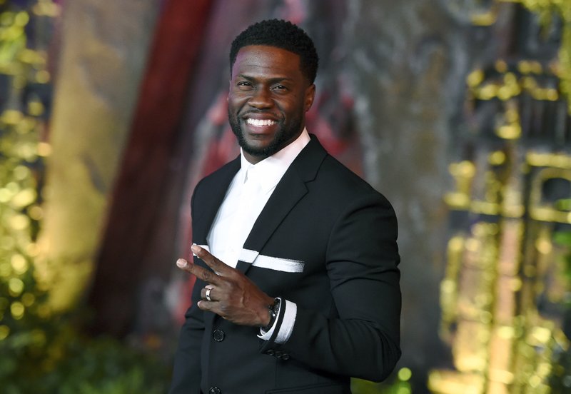 FILE - In this Dec. 11, 2017 file photo, Kevin Hart arrives at the Los Angeles premiere of "Jumanji: Welcome to the Jungle" in Los Angeles. Hart will host the 2019 Academy Awards, fulfilling a lifelong dream for the actor-comedian. Hart announced Tuesday, Dec. 4, 2018, his selection in an Instagram statement and the Academy of Motion Picture Arts and Sciences followed up with a tweet that welcomed him "to the family." (Photo by Jordan Strauss/Invision/AP, File)

