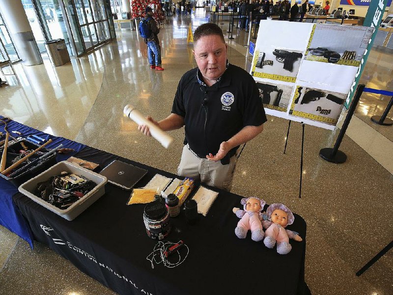 Greg Bronson of the federal Transportation Security Administration speaks Friday at Bill and Hillary Clinton National Airport/Adams Field in Little Rock about items the agency has examined for explosives at the nation’s 512 commercial airports. 