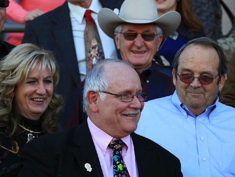 Longtime Oaklawn track announcer Terry Wallace is greeted by staff and friends while watching a race from the grandstand for the first time in January 2011 after ending his streak of 20,191 consecutive race calls. Wallace, 74, died Thursday of complications from progressive supranuclear palsy. 