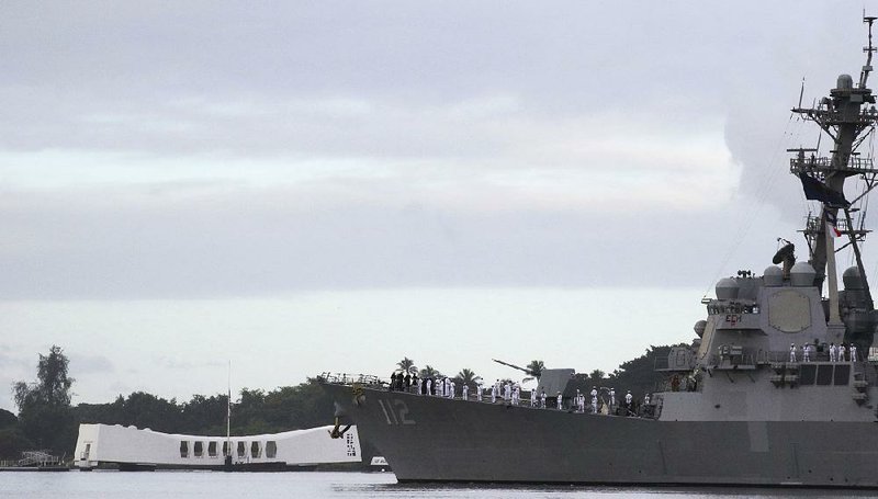 The USS Michael Murphy passes by the USS Arizona Memorial in Pearl Harbor during a ceremony Friday marking the 77th anniversary of the Japanese attack in 1941. 