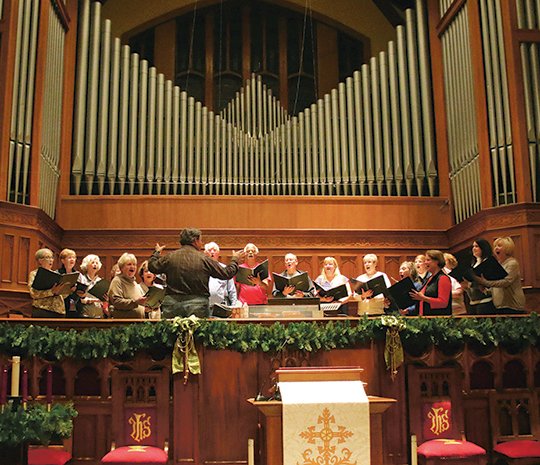 Submitted photo CHOIR PRACTICE: The FUMC Chancel Choir practices for the upcoming concert, "A Grand Central Christmas," under the direction of Timothy Tucker.
