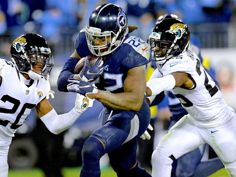 Henry runs into NFL record book as Titans rout Jaguars