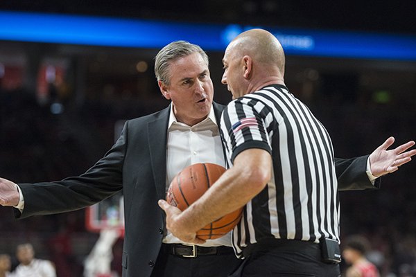 Western Kentucky coach Rick Stansbury talks to an official during a game against Arkansas on Saturday, Dec. 8, 2018, in Fayetteville. 