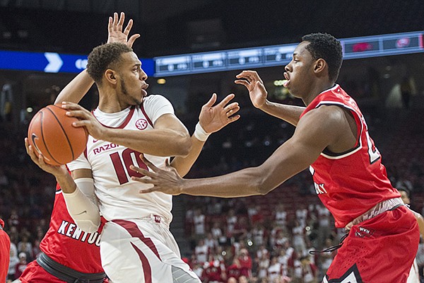 Arkansas' Daniel Gafford (10) is guarded by Western Kentucky's Charles Bassey during a game Saturday, Dec. 8, 2018, in Fayetteville. 