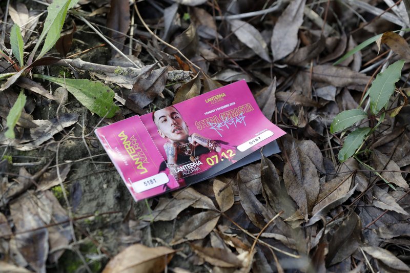 A ticket for the concert of the rapper Sfera Ebbasta that was supposed to be held at disco 'Lanterna Azzurra' is seen in the neighborhood of the club, in Corinaldo, central Italy, Saturday. At least six people, all but one of them minors, were killed and about 35 others injured in a stampede of panicked concertgoers early Saturday at a disco in a small town on Italy's central Adriatic coast. (AP Photo/Andrew Medichini)

