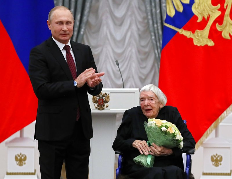 In this file photo taken on Monday, Dec. 18, 2017, Russian President Vladimir Putin, left, congratulates the Moscow Helsinki Group Chair and human rights activist Lyudmila Alexeyeva, during a ceremony to present the 2017 State Awards for Outstanding Achievements in Human Rights and and Charity Work in the Kremlin in Moscow, Russia . Alexeyeva, who was forced into exile by Soviet authorities after founding Russia's oldest human rights organization in 1976, passed away in a Moscow hospital Friday, Dec. 7, 2018 at age 91. (Yuri Kochetkov/Pool Photo via AP, File)