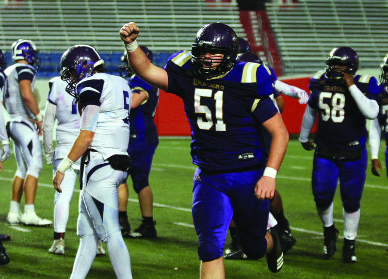 Junction City's Jack Smith (51) celebrates as the clock expires in the fourth quarter of Junction City's 36-22 win in the Class 2A state championship game on Friday at War Memorial Stadium in Little Rock.