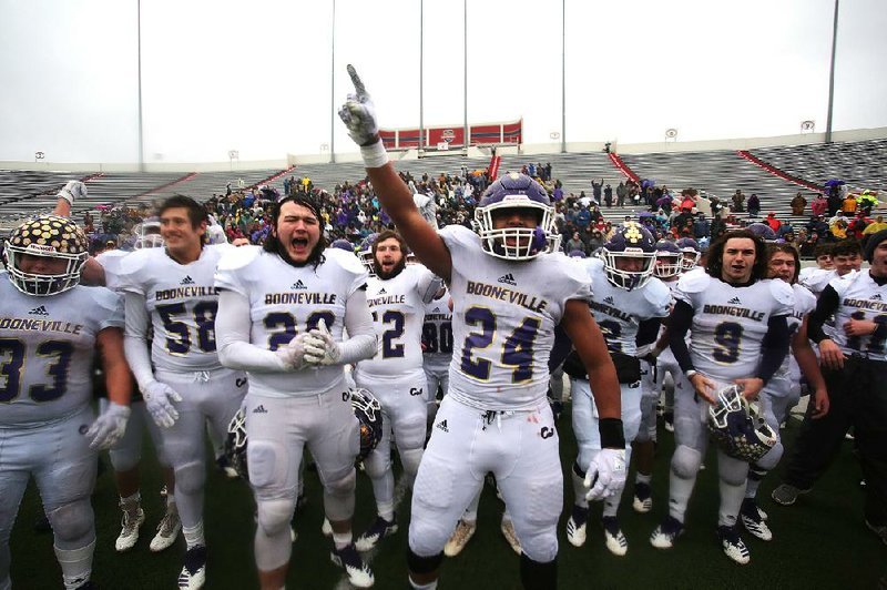 Booneville players prepare to receive the championship trophy after their 35-0 victory over Osceola on Saturday in the Class 3A championship game at War Memorial Stadium in Little Rock. See more photos at arkansasonline.com/galleries