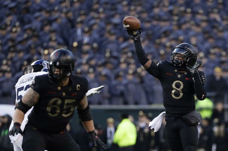 Army’s Kelvin Hopkins Jr. (8) had two rushing touchdowns in leading the Black Knights to a 17-10 victory over Navy on Saturday in Philadelphia. Hopkins had 64 yards rushing on 18 carries and threw for 61 more yards on 4 completions. 