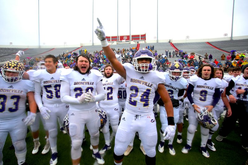 Arkansas Democrat-Gazette/Thomas Metthe UNDEFEATED: Booneville junior Anthony McKesson leads the Bearcats in celebration of their 35-0 win against Osceola on Saturday at War Memorial Stadium in Little Rock to win the Class 3A state championship and complete a 15-0 season.