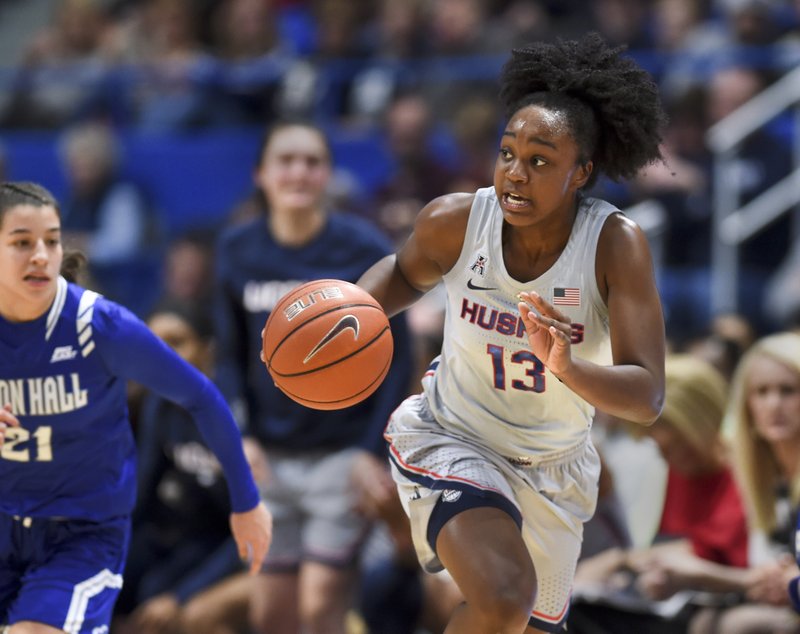 Connecticut's Christyn Williams (13) drives down the court in the first half of an NCAA college basketball game against Seton Hall, Saturday, Dec. 8, 2018, in Hartford, Conn. (AP Photo/Stephen Dunn)