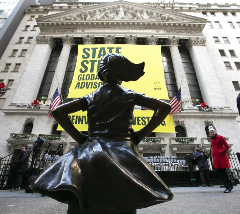 The Fearless Girl statue is unveiled at its new location in front of the New York Stock Exchange, Monday, Dec. 10, 2018, in New York. The statue, considered by many to symbolize female empowerment, was previously located near the Charging Bull statue on lower Broadway. (AP Photo/Mark Lennihan)