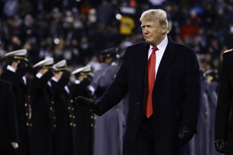 President Donald Trump crosses the field after the first half of an NCAA college football game between the Army and the Navy, Saturday, Dec. 8, 2018, in Philadelphia. (AP Photo/Matt Rourke)

