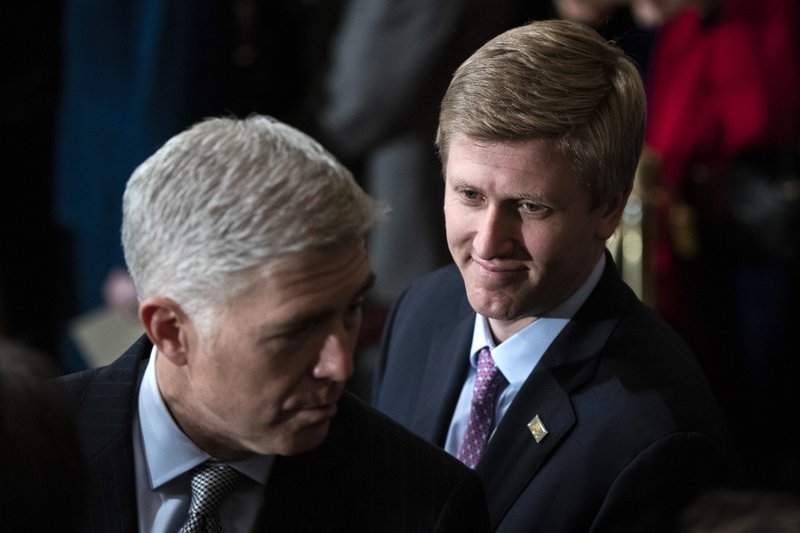 In a Dec. 3 file photo, Nick Ayers, right, listens as Supreme Court Associate Justice Neil Gorsuch waits for the arrival of the casket for former President George H.W. Bush to lie in State at the Capitol on Capitol Hill in Washington. President Donald Trump's top pick to replace John Kelly as chief of staff, Nick Ayers, is no longer expected to fill that role, according to a White House official. The official says that Trump and Ayers could not agree on Ayers' length of service. (Jabin Botsford/The Washington Post via AP, Pool, File)

