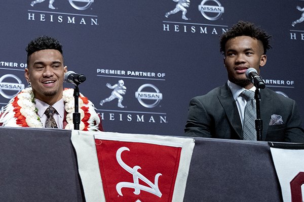 Heisman Trophy finalists, from left, Dwayne Haskins, from Ohio State; Tua Tagovailoa, from Alabama; and Kyler Murray, from Oklahoma, share a light moment during a media event Saturday, Dec. 8, 2018, in New York. (AP Photo/Craig Ruttle)
