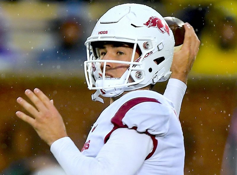 NWA Democrat-Gazette/Charlie Kaijo ONE SPORT: Arkansas freshman quarterback Connor Noland looks for a receiver on Nov. 23 during the third quarter of the Razorbacks' road loss to the Tigers in Columbia, Mo.